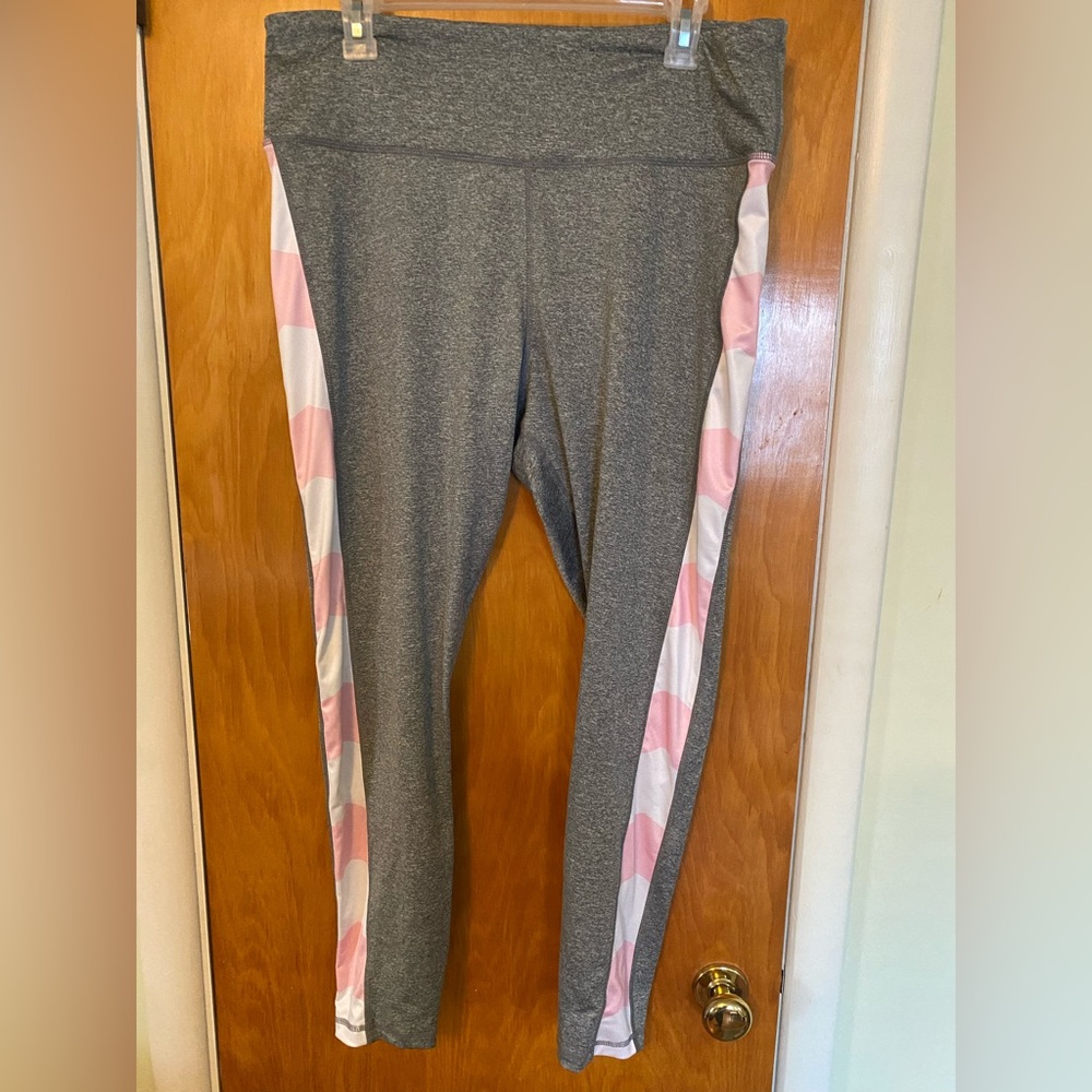 Grey workout or casual leggings. Pink and white stripe accent on each side.
